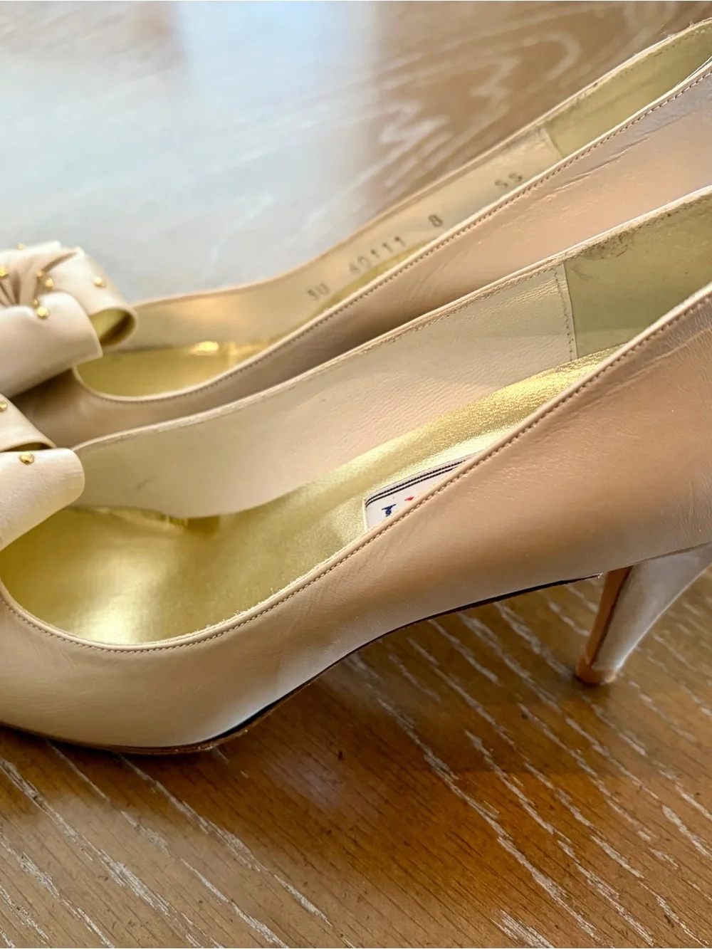 Stuart Weitzman Pearl Bow Pointy Pumps in Light Beige with Gold Studs